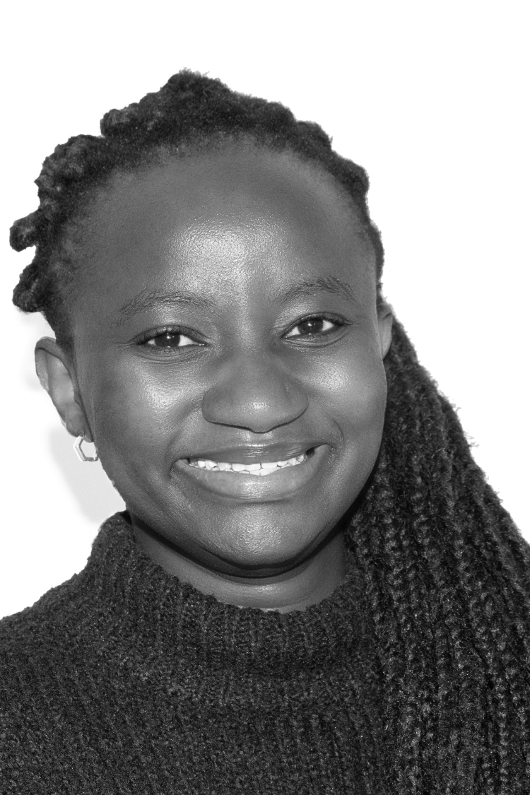 A black and white image of Carol. She is wearing a turtleneck. 